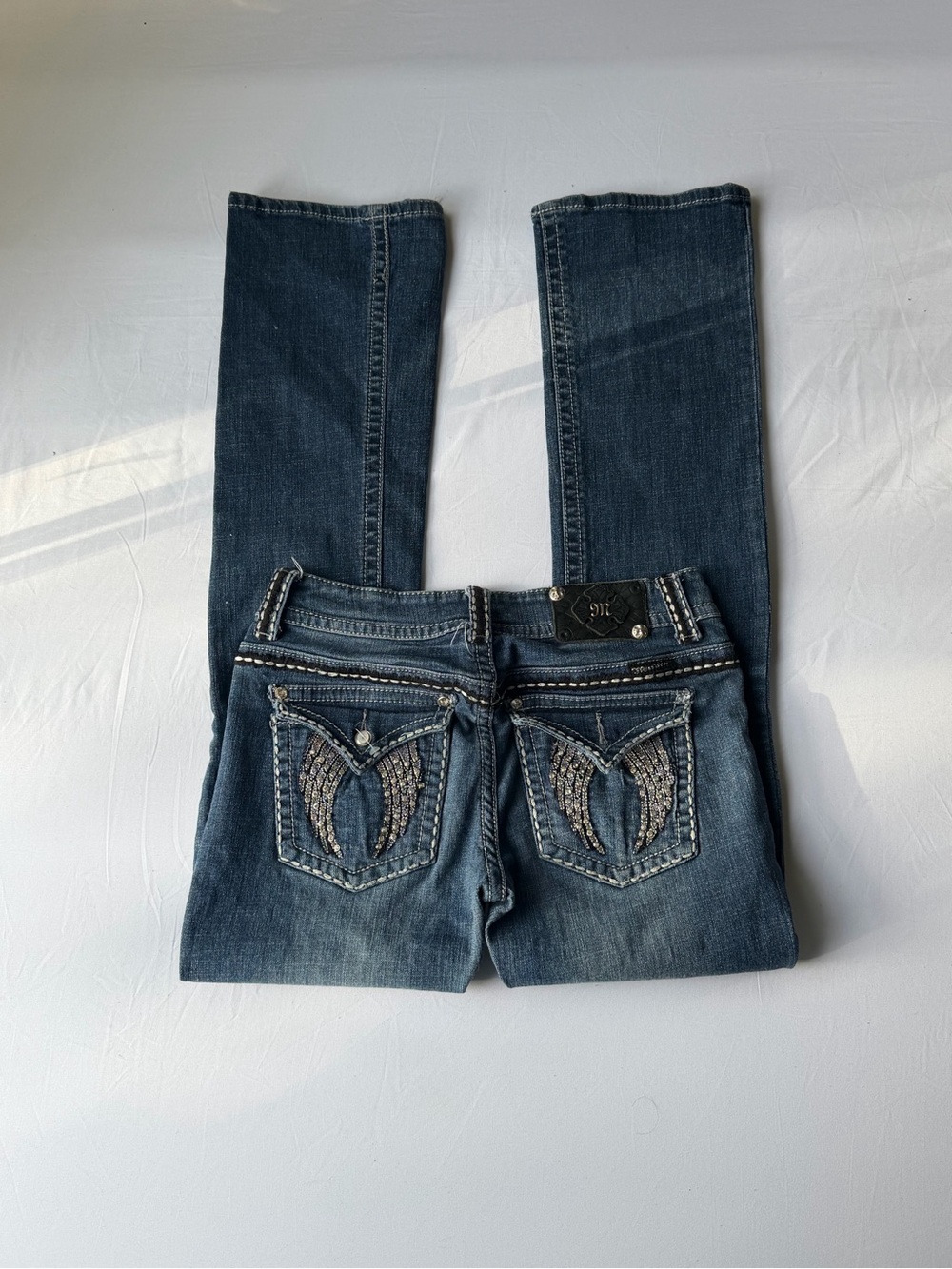 Angel winged gem embellished miss me jeans